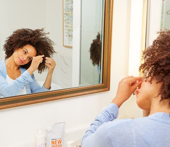 Woman Moisturizing Natural Curly Hair